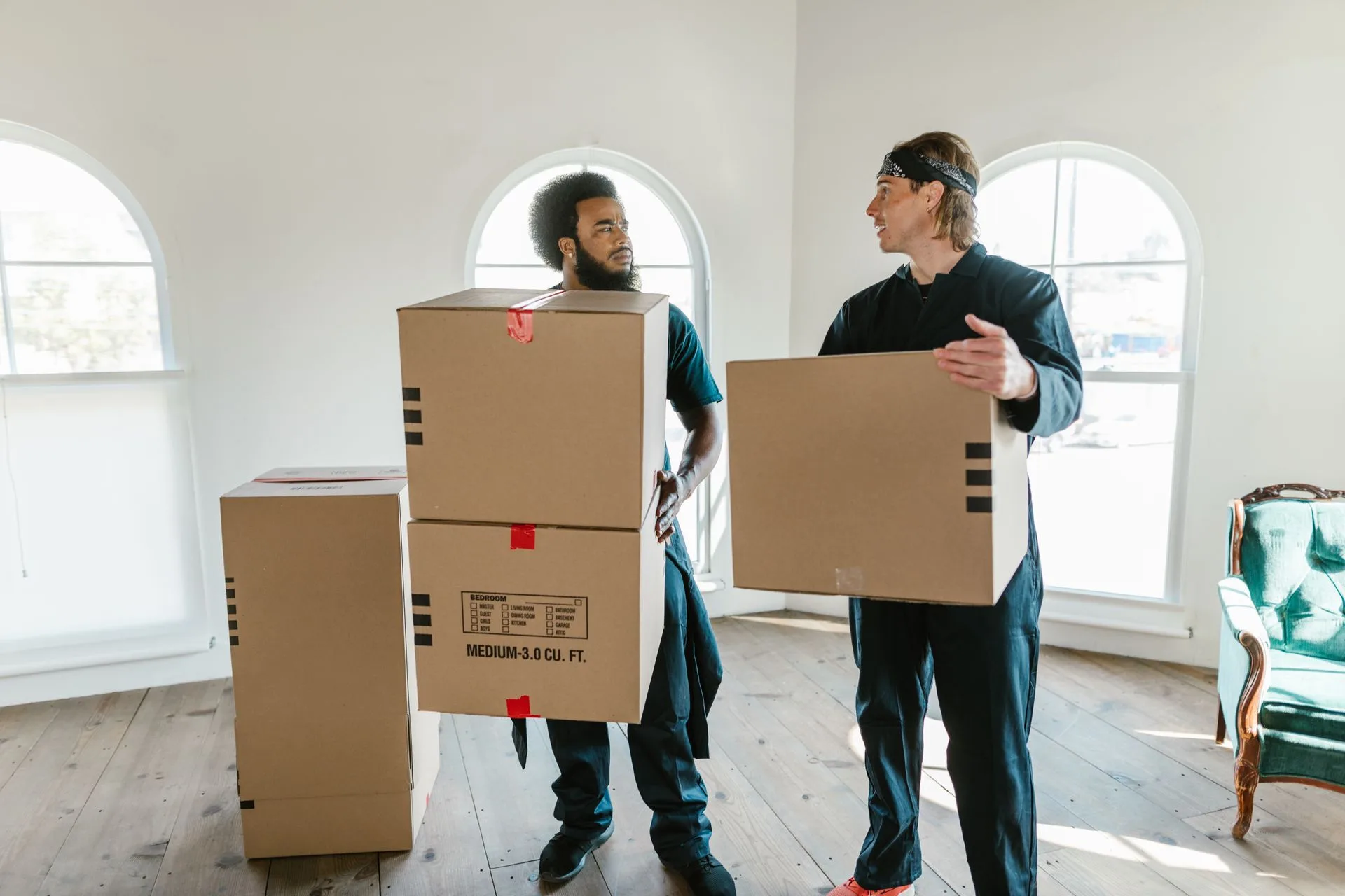 Moving company crew loading a truck at a residential job